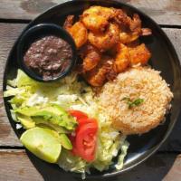 Camarones Al Mojo De Ajo · Slightly seasoned, spicy shrimp cooked in garlic sauce and served with Mexican rice, beans, ...
