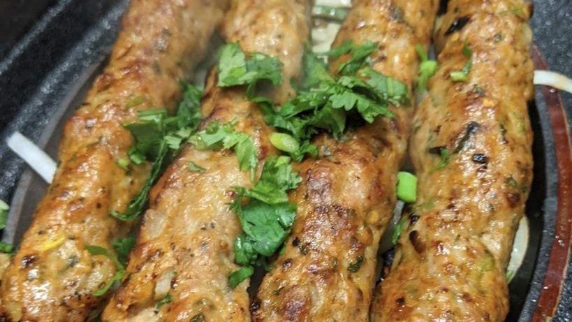 Chicken Seekh Kabab (4 Pieces) · Minced chicken kababs marinated with fresh spices, juicy and flavorful cooked in tandoor.
