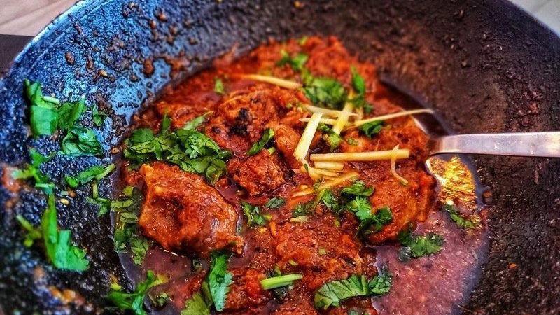 Goat Karahi · A Peshawari style stirs fry chicken with plump tomato curry, spiced with black pepper and garam masala. Served with Raita. May contain or come into contact with wheat, eggs, peanuts, tree nuts, and milk.