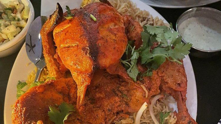 Sajji Pulao · Rotisserie chicken immersed in vinegar based spicy marinade, topped with lemon and sajji massala. Served with special sajji rice (serves three).