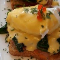 Eggs Benedict · A savory combination of  spinach, smoked lox, a runny egg and hollandaise sauce.