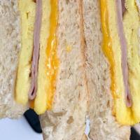 Brooklyn · Ham and Cheddar folded into a two eggs omelet on on a soft brioche.