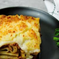 Pastichio · Authentic Greek baked pasta layered with a homemade ground beef and béchamel sauce.