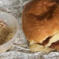 Buttermilk Fried Chicken · Fried chicken, coleslaw, honey and pickles on a brioche roll. Coleslaw comes on the side. Fr...