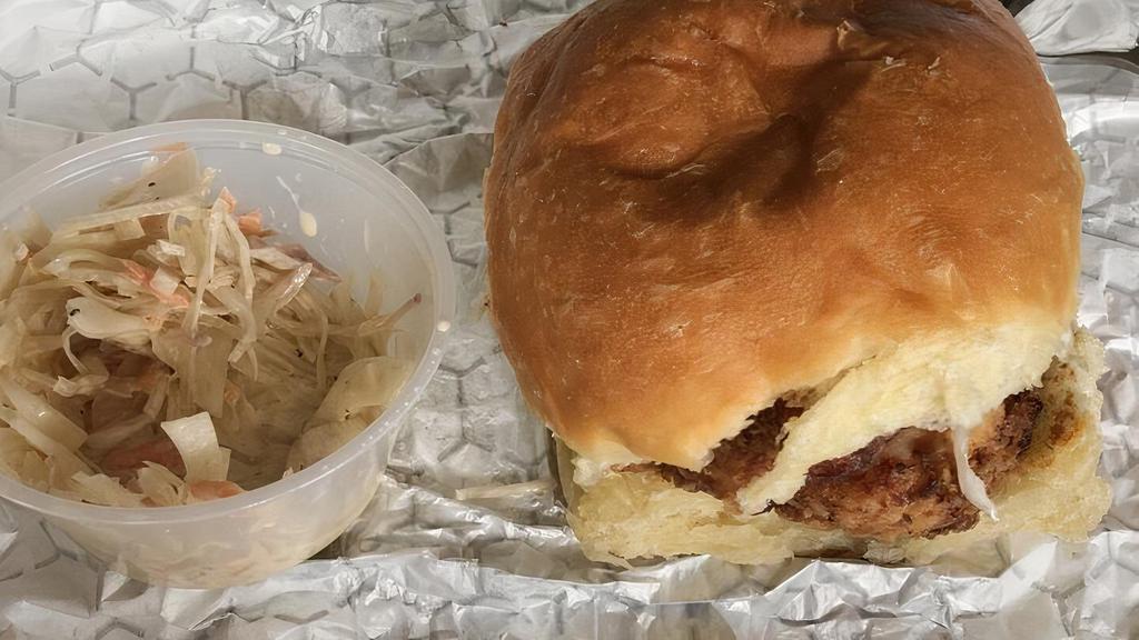 Buttermilk Fried Chicken · Fried chicken, coleslaw, honey and pickles on a brioche roll. Coleslaw comes on the side. French fries served on the side