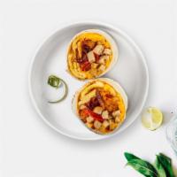 Say Sausage Breakfast Burrito · Sausage, eggs, tater tots, cheddar cheese, tomatoes and caramelized onions wrapped in a flou...