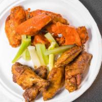 Buffalo Wings (10) · Served with celery and 1 dressing per 10 pc wings. our wings are always cooked fresh to order.