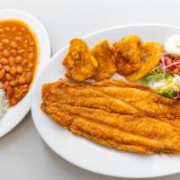 Filete De Pescado Frito ( Corvina ) / Fried Fish Fillet Served · Con arroz, frijoles, ensalada y tostones / Served with rice, beans, salad & green plantains