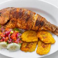 Pargo Rojo Frito/ Fried Red Snapper · Con arroz, frijoles, ensalada y tostones / Served with rice, beans, salad & green plantains