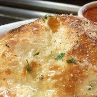 Cheese Calzone · Calzone Stuffed With Ricotta and Mozzarella Served With A Side Of Marinara Sauce.