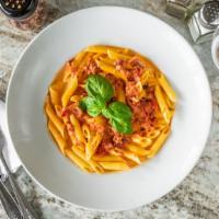 Penne Alla Vodka · Penne cooked with vodka, cream, prosciutto and a touch of marinara sauce.