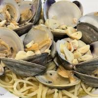 Linguini Con Vongole · Our authentic clam sauce includes fresh chopped and whole baby clams sautéed in a roasted ga...
