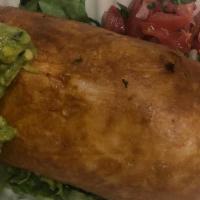 Chimichanga · (Deep fried burrito). Made with Spanish rice and re-fried beans. Topped with sour cream, let...