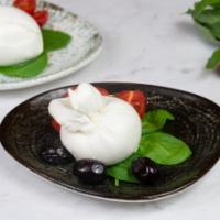 Burrata · Cow's milk cheese with creme in the center.