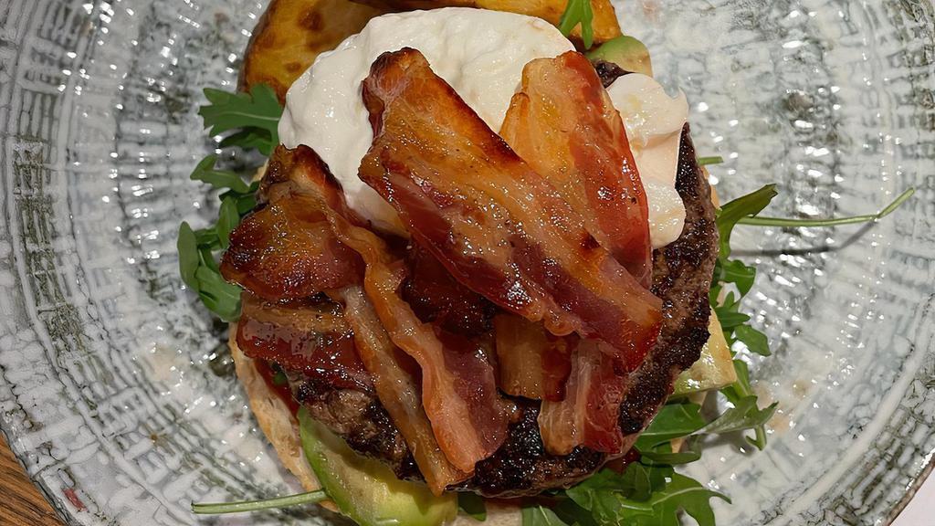 Black Angus Burger With Burrata · burrata, applewood bacon, avocado, apple mustard, and roasted potatoes on the side.