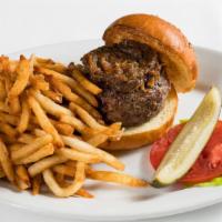 Black Label Burger · Selection of prime dry-aged beef cuts, caramelized onions, and pommes frites.