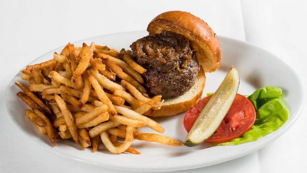 Black Label Burger · Selection of prime dry-aged beef cuts, caramelized onions, and pommes frites.