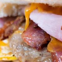 Hungry Man · Hungry man Hero : eggs, ham, sausage, bacon and cheese on a Hero