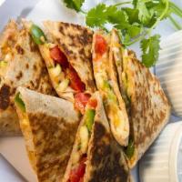 Veggie Quesadilla · Assorted seasoned vegetables with Cheddar and Pepper Jack cheese. Includes sour cream, guaca...