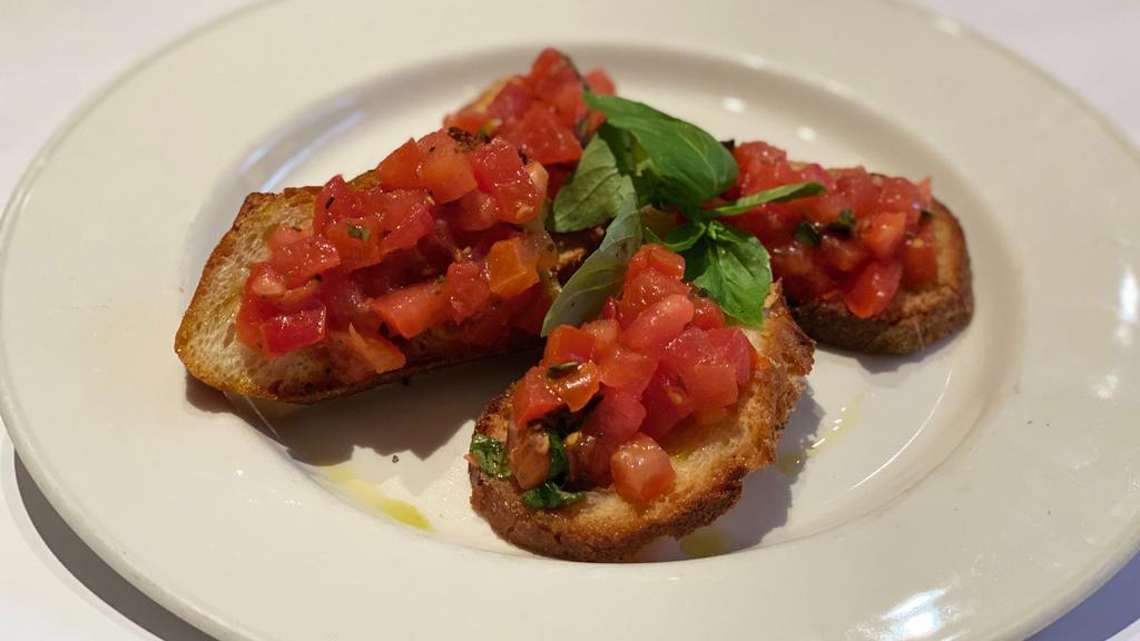 Bruschetta · Toasted bread with marinated fresh tomatoes, basil, extra virgin olive oil & a touch of garlic.