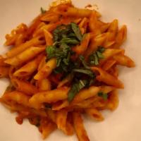 Penne Pomodoro & Basilico · Homemade tomato sauce, Parmigiano Reggiano & fresh basil.