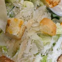 Caesar Salad · Romaine lettuce tossed with parmesan cheese, croutons with our creamy Caesar dressing.