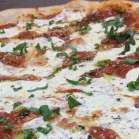 Margarita Pizza · Fresh plumed tomatoes, basil, fresh mozzarella & garlic