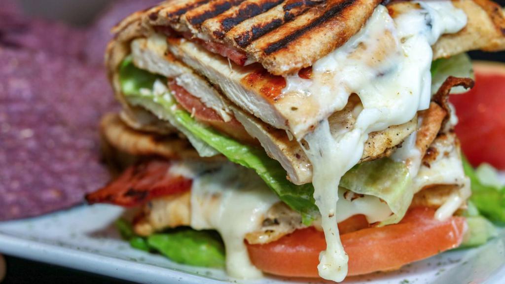 Grilled Chicken Club Panini · Grilled chicken, lettuce, tomatoes, turkey bacon, mayonnaise and non-fat mozzarella cheese.