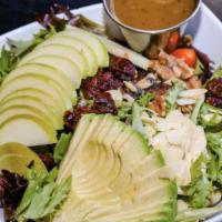Guadalajara Salad · Mixed baby greens, walnuts, cranberries, almonds, tomato, avocado and green apple with Carri...