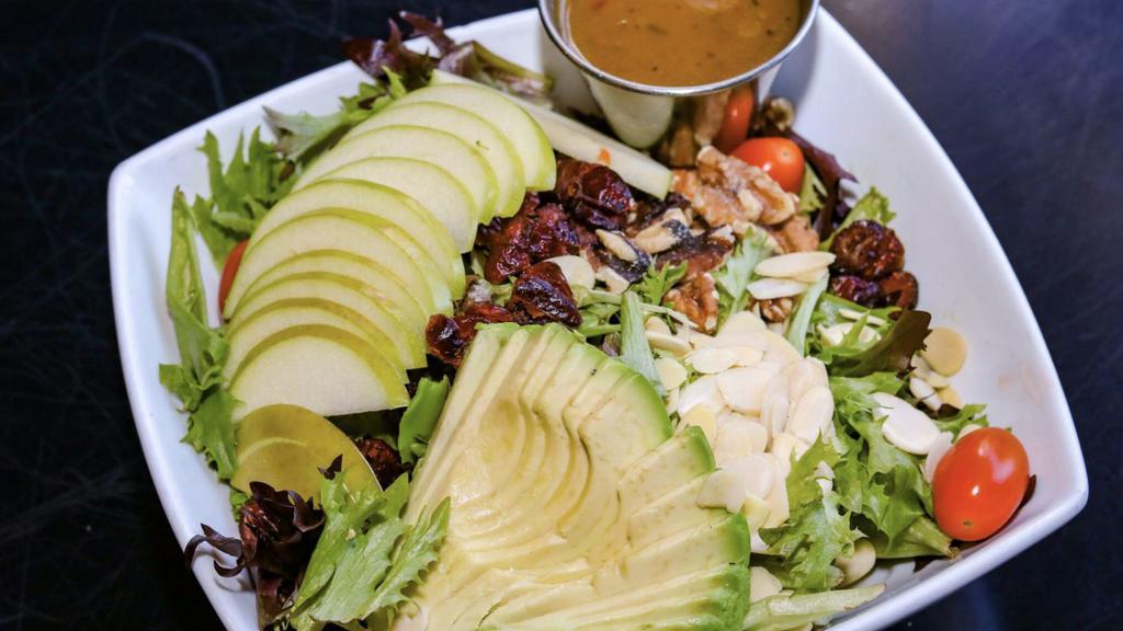 Guadalajara Salad · Mixed baby greens, walnuts, cranberries, almonds, tomato, avocado and green apple with Carribean mango dressing. Also available with chicken or salmon for an additional charge. Vegetarian.