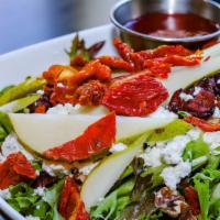 Nature'S Grill Pear Salad · Mesclun greens, dried cranberries, walnuts, sun-dried tomatoes, goat cheese and sweet pear t...