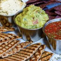 Nature'S Grill Dip Trio · Hummus, salsa, guacamole with blue chips and toasted whole wheat pita