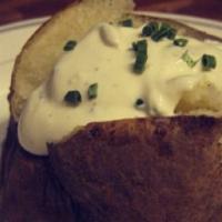 Baked Potato With Sour Cream · Add turkey bacon, scallions, cheddar, broccoli for an additional charge. Gluten free.