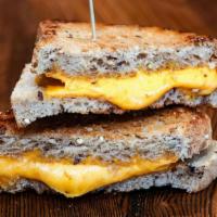 Kids Grilled Cheese · Mild cheddar cheese on toasted 7-grain bread. Vegetarian.