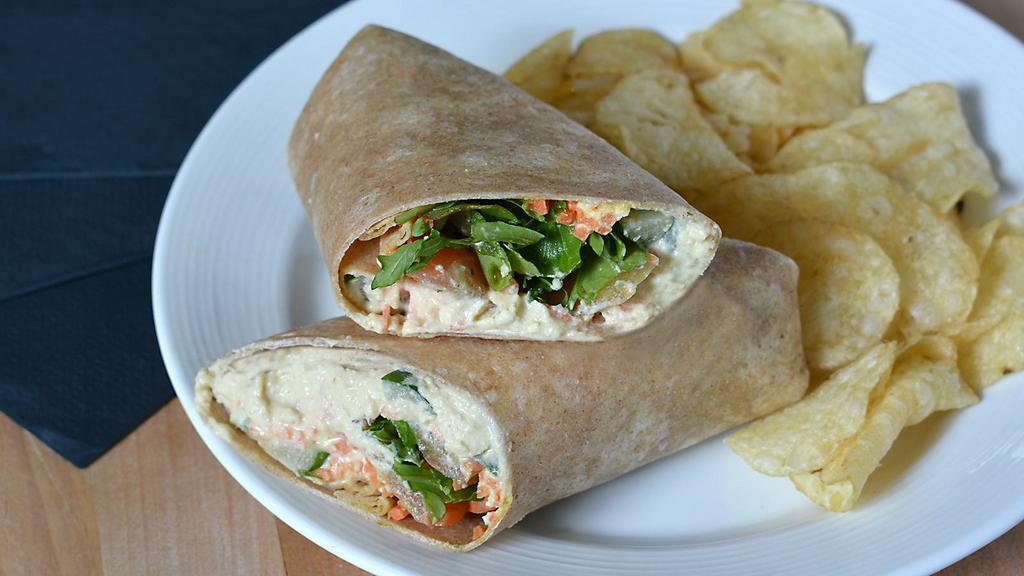 Hummus Wrap · Classic hummus, roasted red peppers, arugula, tomato, cucumber, on whole wheat wrap served with kettle chips.