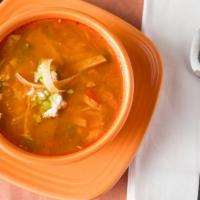 Sopa De Tortilla · Shredded chicken in spicy broth with tomato peppers, onion, and chili with guacamole, cheese...