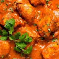 Chicken Tikka Masala · Chicken tikka cooked in a clay oven then cooked to a curry using thick fresh onions, peppers...