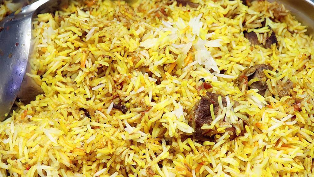 Lamb Biryani · Basmati rice cooked with boneless lamb, spices and special herbs.
