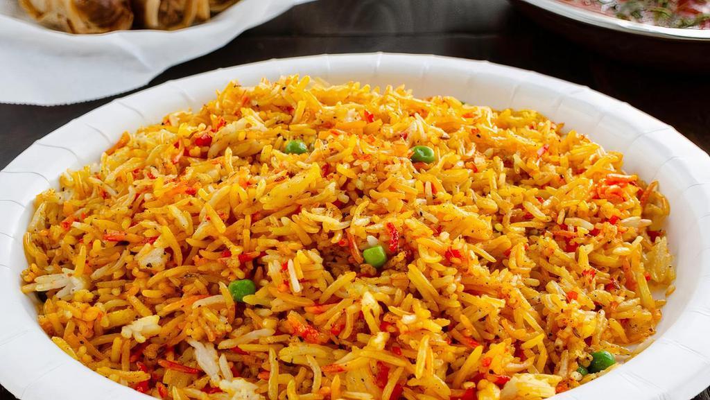 Vegetable Biryani · Basmati rice cooked with mixed vegetables, spices and special herbs.