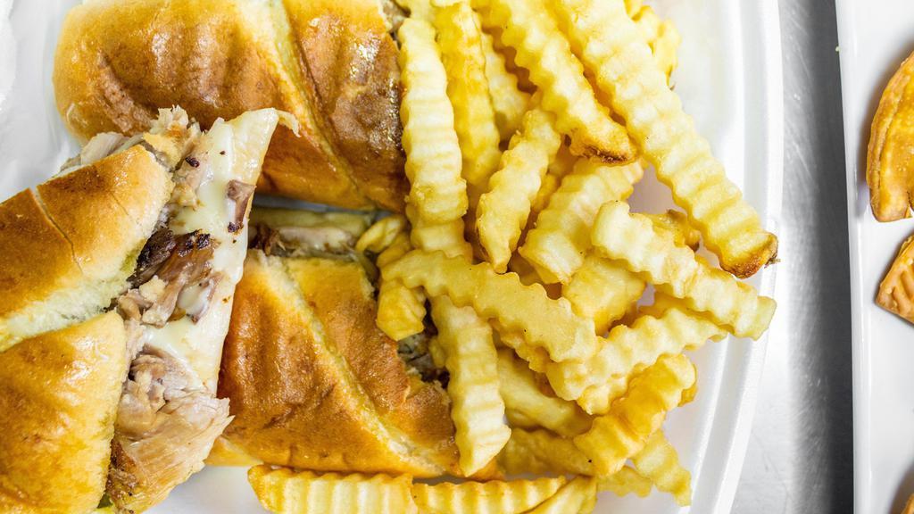 Cuban Sandwich (Large) & French Fries (Large) · Roasted pork with melted swiss cheese and honey ham toss with pickles and garlic spread butter on a Cuban toasted bread served with french fries