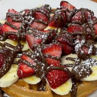 Nutella Waffle · Nutella, Strawberries and bananas, dusted with powdered sugar