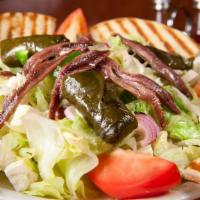 Greek Salad · Lettuce, tomatoes, onions, peppers, kalamata olives, feta cheese, anchovies, cucumbers and s...