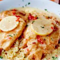 Chicken Francaise · Chicken breast sauteed in a lemon butter wine sauce, served over linguine or rice.