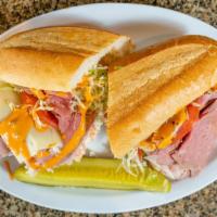 The Sloppy Joe Sandwich · The house favorite Sub sandwich features Roast Beef & Oven-Roasted Turkey, creamy coleslaw, ...