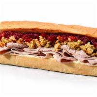 Thanksgiving Toasted (Medium) · Hand-sliced Turkey Breast, Stuffing, Cranberry Sauce & Mayo, served with a side of Hot Gravy...