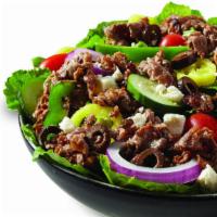 Greek Steak Salad · Hot Grilled Sirloin Steak, Crisp Romaine Lettuce, Onions, Tomatoes, Cucumbers, Green Peppers...