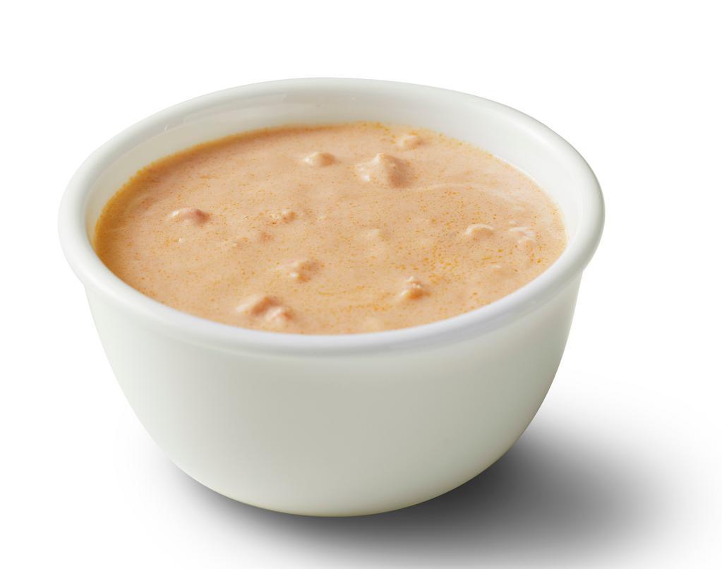 Lobster Bisque · A perfect blend of sweet lobster meat simmered in rich cream and sherry.