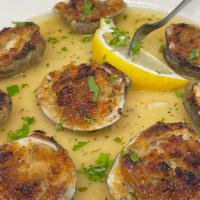 Baked Clams (8) · Freshly opened and breaded whole clams, served with lemon