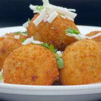 Rice Balls · Imported arborio rice, blended with Italian herbs & cheeses, served with vodka sauce