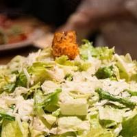 Caesar Salad · Romaine Lettuce Tossed In Homemade Caesar Dressing Topped With Pecorino Romano And Crumbled ...